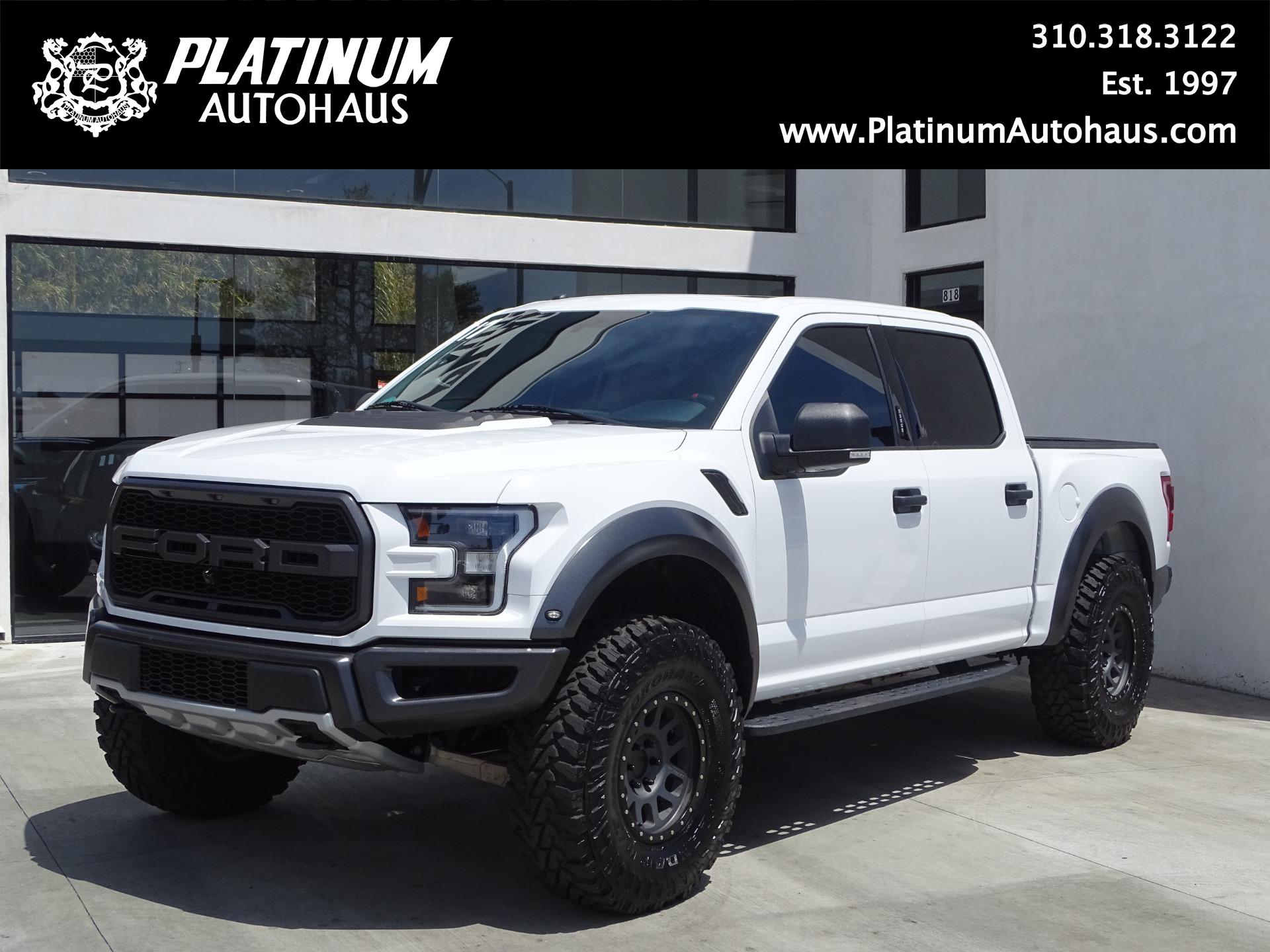 ford raptor lifted white
